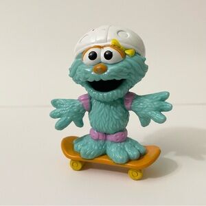 2011 Sesame Street Rosita on Skateboard Plastic Figure Toy Hasbro